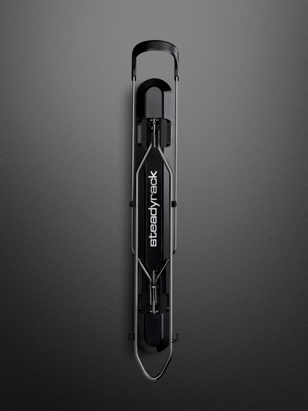 Black bike rack with 'steadyrack' branding on a gray background