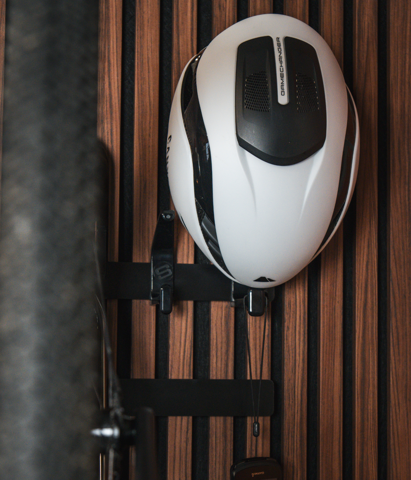 White and black helmet on a wooden surface