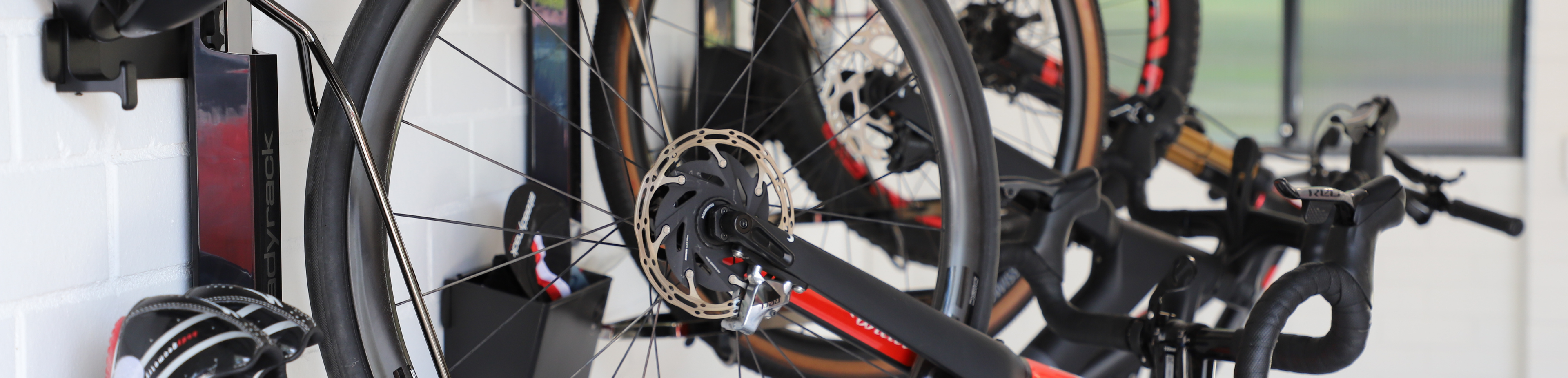 Bicycle mounted on a wall rack with a blurred background