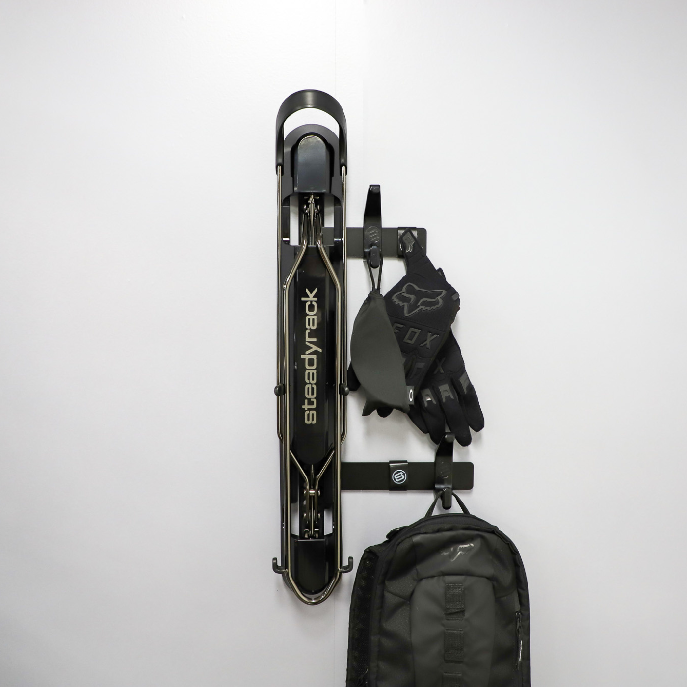 Accessory hooks and loops holding gloves and a bag on a ProFlex Rack