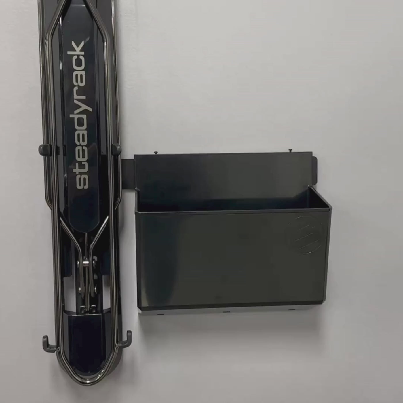 A bike rack with a black bin attachment. 